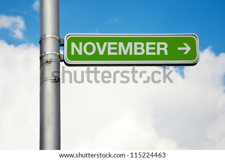 November. Direction street sign - November with arrow pointing to the right