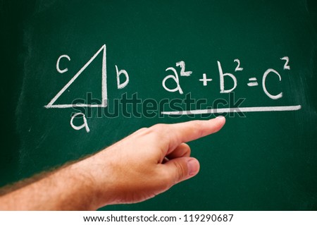 Pythagorean theorem sketched with white chalk on a chalk board