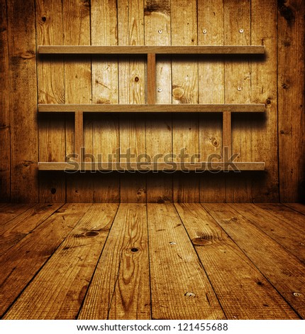 Empty bookshelf. Vintage wooden bookshelf over a grungy background