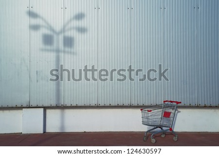 Empty shopping cart in front of the supermarket