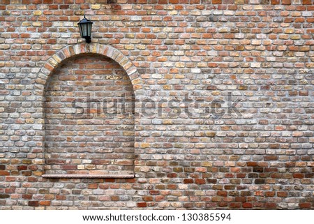 beautiful brick wall and a black street lantern