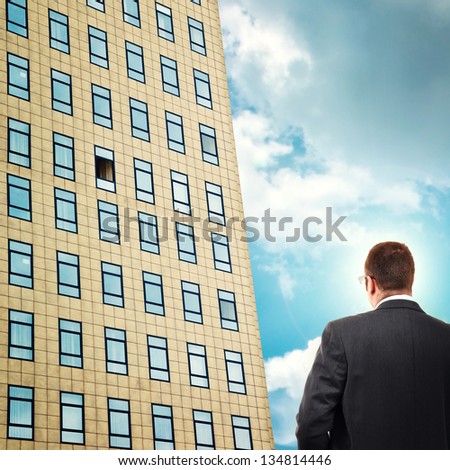 Career opportunity. Businessman facing company building, looking at open office window.