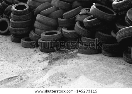 Waste car tires. Old used car tires stack.