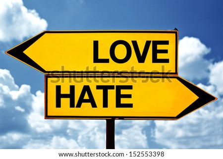 Love versus hate, opposite direction signs as concept of choices we make in life