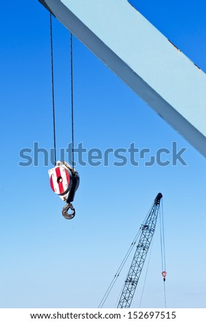 Construction crane hook, industrial machinery detail.