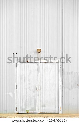 Warehouse door, old obsolete metal door.