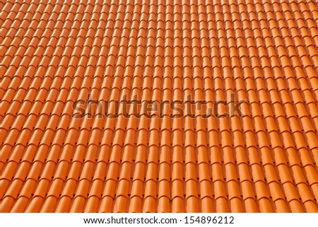 Roof texture tile. Abstract background tile of orange clay roof.