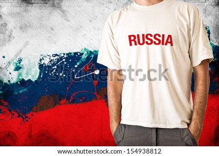 Man in white shirt with title RUSSIA, Russian flag in background