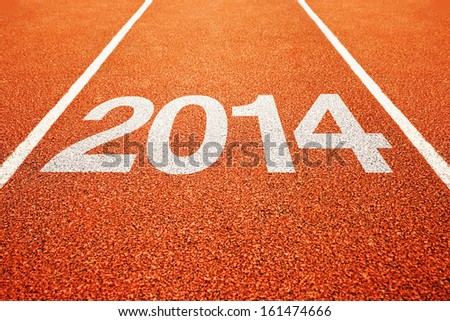 Number 2014 on athletics all weather running track. Happy new 2014 year. Running fast towards New Year.