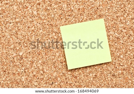 Cork Board with yellow Sticky Note Paper
