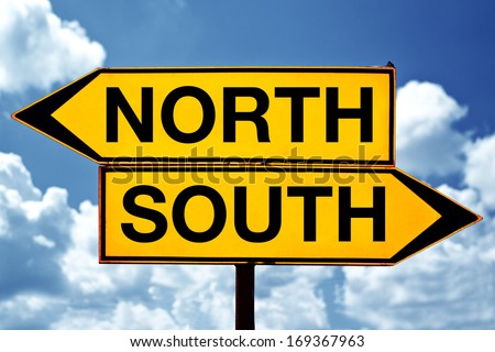 North versus south, opposite direction signs