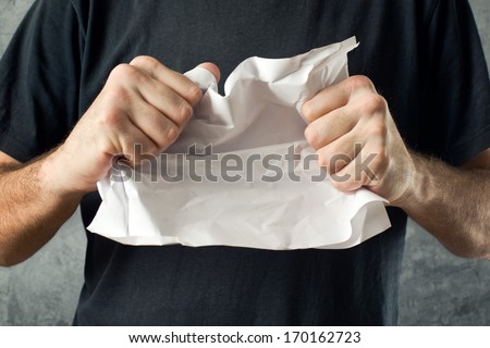Man tearing contract paper. Bad ideas or project mistakes concept.