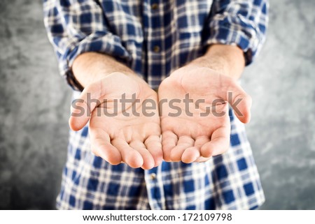 Need help/ Cupped hands hopefully held up, asking for help or charity
