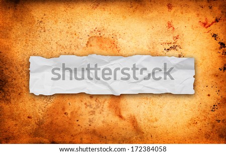 Torn dirty cardboard paper as a background for your title or design.