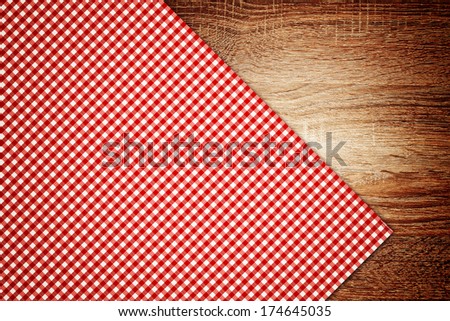 Top View of Table cloth, kitchen napkin on wooden table as background