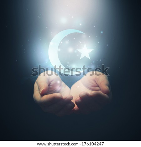 Female hands opening to light and half moon and star symbol of islam religion Female hands opening to light and half moon and star symbol of islam religion