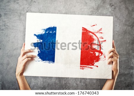 France flag. Man holding banner with French Flag. Supporting national team, patriotism concept.