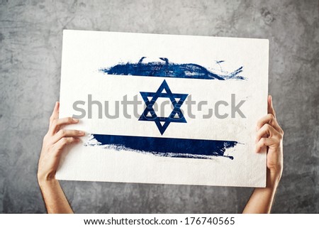 Israel flag. Man holding banner with Israelian Flag. Supporting national team, patriotism concept.