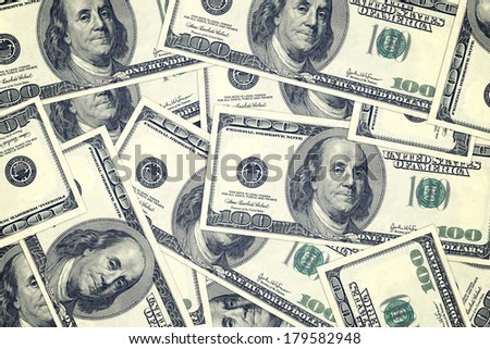 Hundred dollar bills as background. Money pile, financial theme.