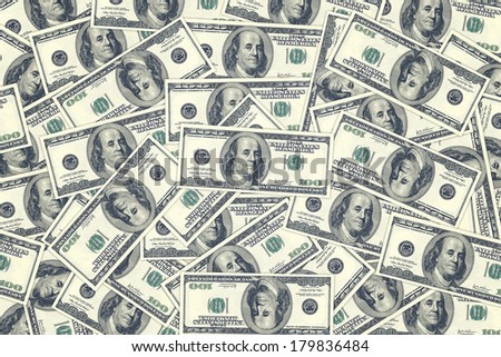 Hundred dollar bills as background. Money pile, financial theme.