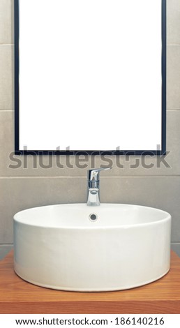 Washbasin in modern elegant bathroom with mirror on the wall, interior detail