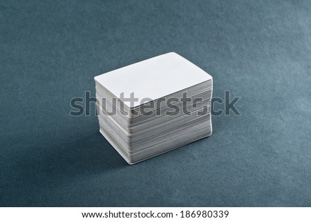 Business cards with rounded corners. Stack of blank horizontal business cards propped up another with copy space for your design