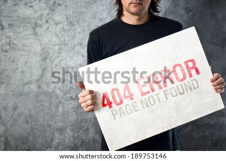404 error, page not found. Web designer holding paper with printed error web page. Internet technology concept.