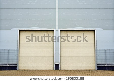 Industrial Unit with roller shutter doors. Warehouse storage doors closed.