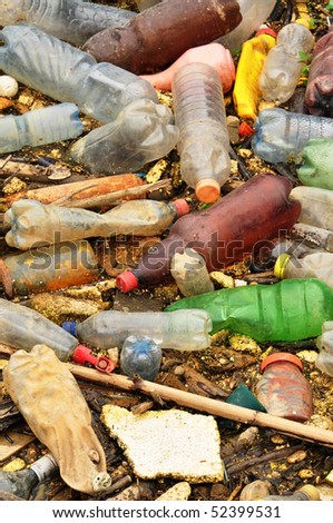 Plastic garbage in the river. Huge pile of plastic garbage of all sorts in the river, ecology issue.