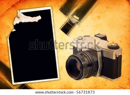 Vintage photography theme background. Analog camera, photo frame and camera film strip blended on a grunge paper texture