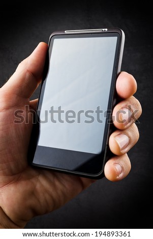 Male Hand with mobile smart phone. New technology concept for e-mails, social networking, wireless internet and information era.