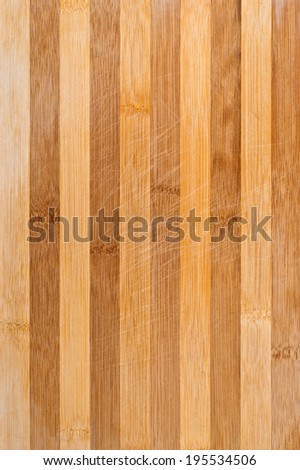 Worn butcher block cutting and chopping wooden board as background. Wood texture.