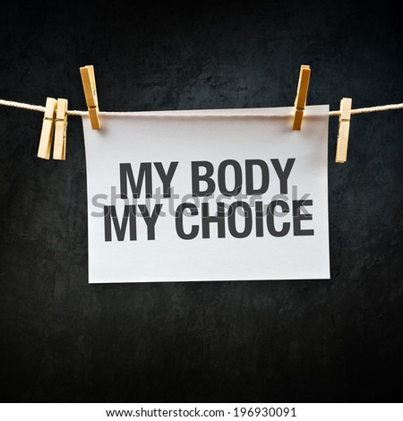 My Body My Choice message printed on paper hanging on clothesline.
