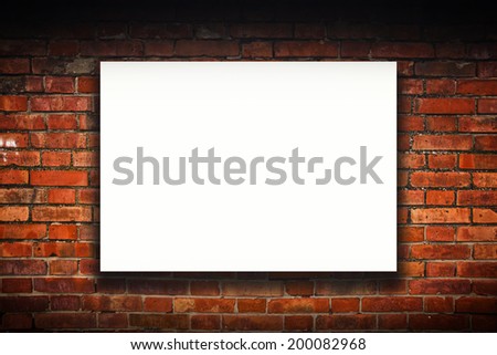 Blank poster on old brick wall. Outdoor advertising copy space.
