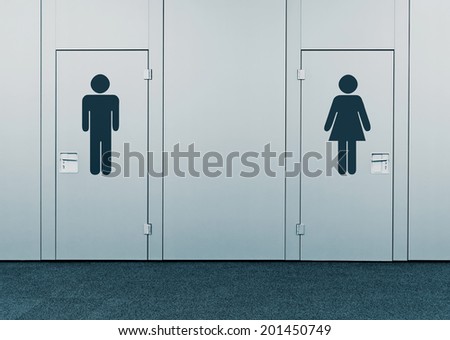 Ladies room and mens room. Closed toilet doors with printed marks.
