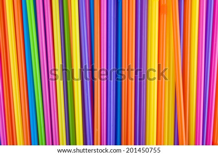 Drinking straws as colorful abstract seamless background. Plastic tubes used for drinking different beverages, juices, alcohol drinks and cocktails.