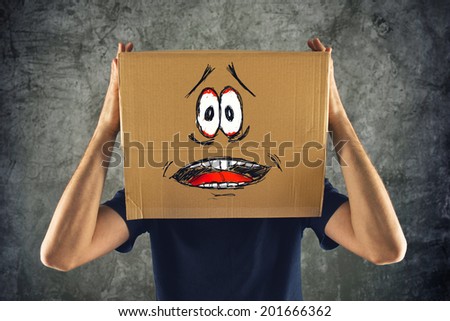 Man with cardboard box on his head and terrified look sketched. terrified; frozen; scared man.