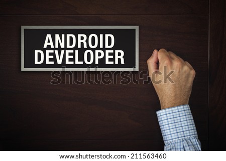 Businessman knocking on the office door of a Android Developer looking for a computer programmer service.