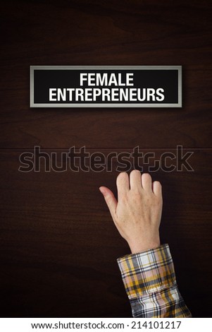 Woman hand is knocking on Female entrepreneurs door, conceptual image