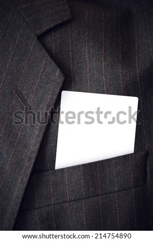 Blank visiting business card in businessman corporate suit pocket. Copy space template for design or text.