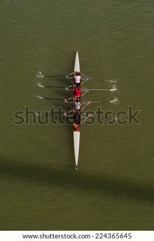 NOVI SAD, SERBIA - OCTOBER 18, 2014: Four women rowing on Danube River in Novi Sad on traditional remote regatta competition.