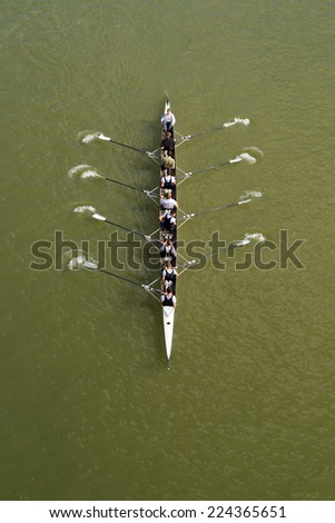 NOVI SAD, SERBIA - OCTOBER 18, 2014: Eight men rowing on Danube River in Novi Sad on traditional remote regatta competition.