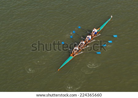 NOVI SAD, SERBIA - OCTOBER 18, 2014: Aerial Top View of Four men rowing on Danube River in Novi Sad on traditional remote regatta competition.