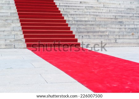 Red carpet on staircase marking the route taken by celebrities on ceremonial events