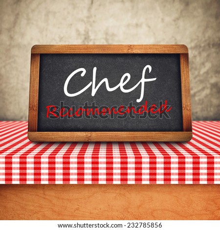 Chef Recommended Title in white chalk on Restaurant Blackboard. Food and Nutrition background.