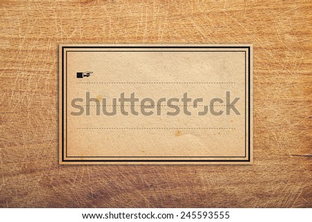 Vintage retro Sticker paper Label Tag as Copy Space on Wooden Background
