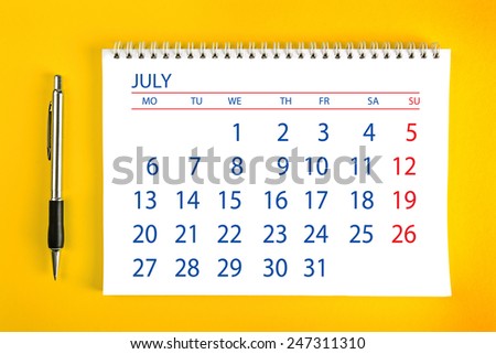 July Paper Calendar Page with Spiral Binding as Time Management and Schedule Concept.