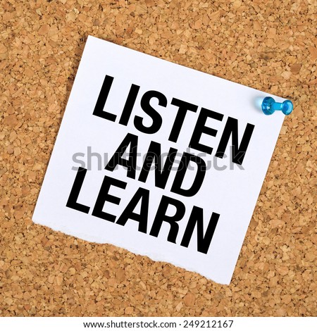 Listen And Learn Reminder Note on Cork Bulletin Board.
