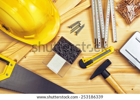Assorted Woodwork and Carpentry or Construction Tools on Pine Wood Texture Background.