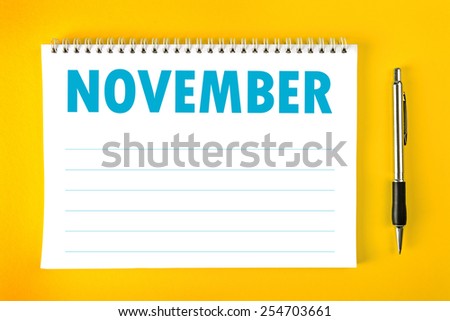 November Paper Calendar Blank Page with Spiral Binding as Time Management and Schedule Concept, top view